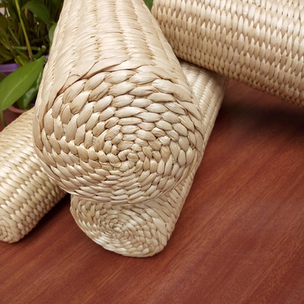 Coussin cylindrique en rotin